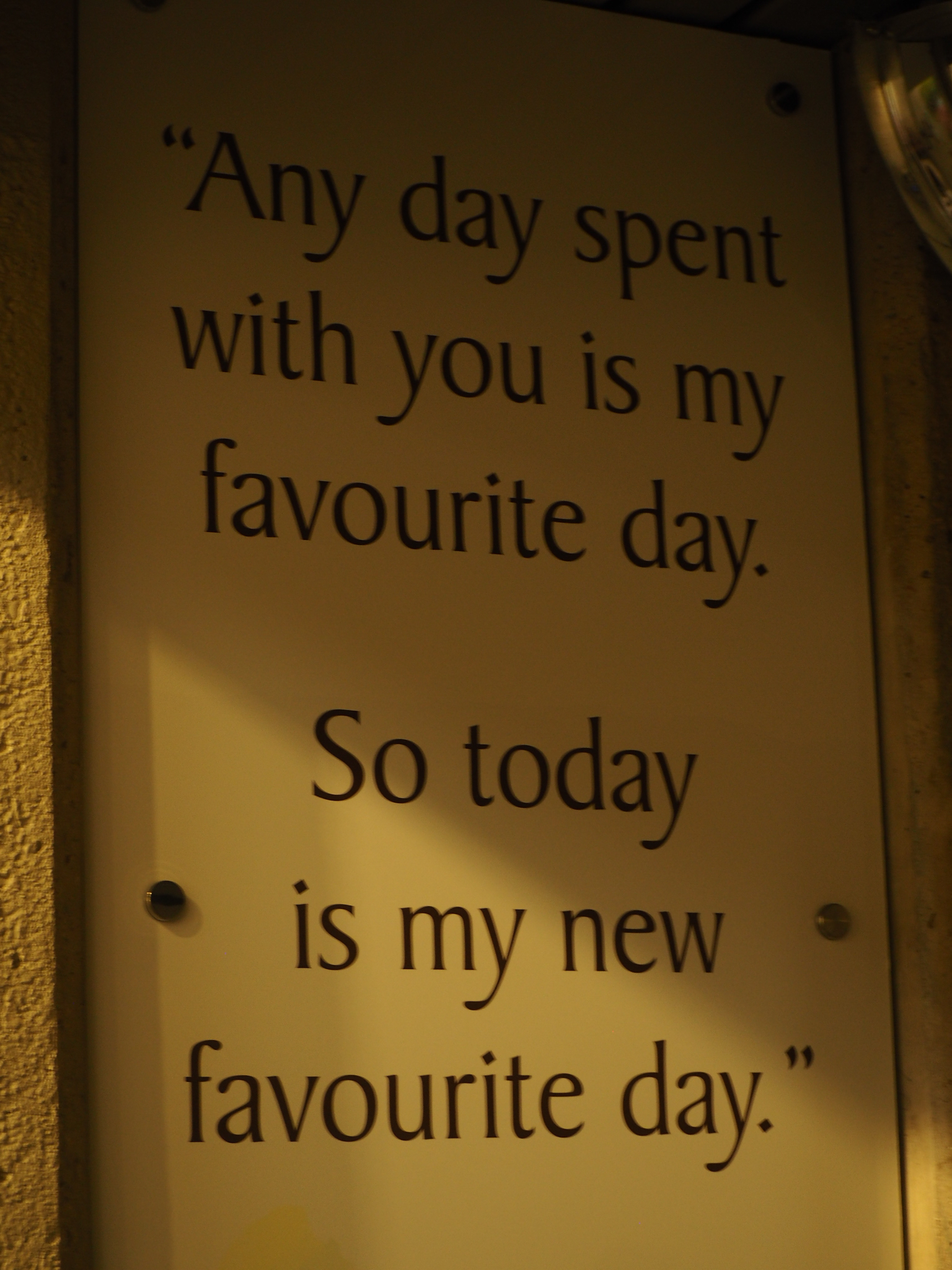 warm yellow quote sign reading any day spent with you is my favourite day