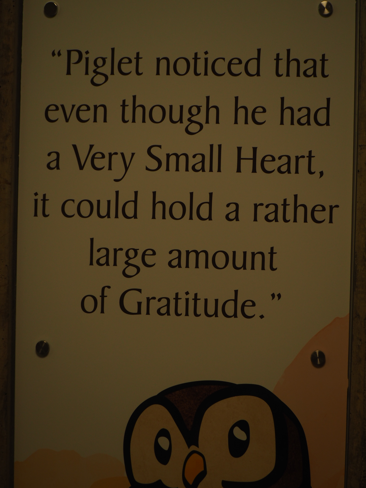 painted garden sign with a piglet quote about a small heart and gratitude
